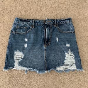 Distressed denim mini skirt